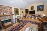 Main living area with flat screen TV, extensive reading library